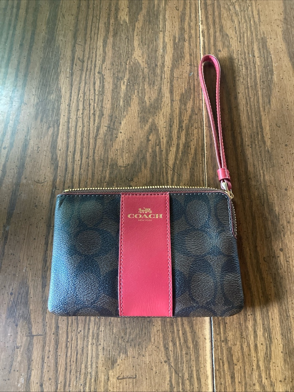 Coach Brown Signature Canvas Wristlet with Pink Center Stripe logo